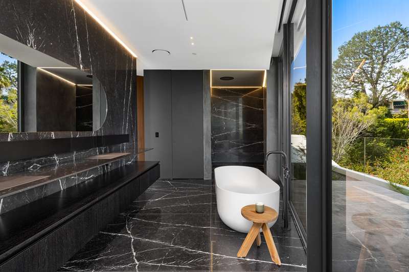 Tile Trims with lights in black bathroom